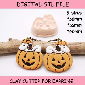 May include: A digital STL file for a clay cutter for earrings, featuring a design of a white dog resting on an orange jack-o'-lantern pumpkin. The text reads DIGITAL STL FILE, 3 sizes, 30mm, 35mm, 40mm, and CLAY CUTTER FOR EARRING.