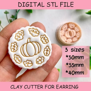 May include: A white circular clay cutter for earrings featuring a central pumpkin design surrounded by a ring of leaves with gold-colored outlines. The text DIGITAL STL FILE and CLAY CUTTER FOR EARRING are present, along with 3 sizes: 30mm, 35mm, 40mm.