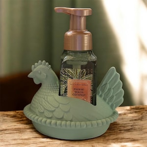 May include: A set of three ceramic mugs with a speckled, matte finish in cream, light grey, and dark grey. Each mug has a simple, minimalist design, suitable for coffee or tea.