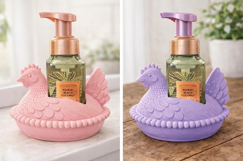 May include: Two chicken-shaped soap holders, one pink and one purple, each holding a soap dispenser. The dispensers have bronze pumps and labels reading "Waikiki Beach Coconut". The holders are ceramic.