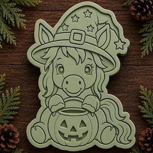 May include: A sage green cookie cutter shaped like a pony wearing a pointed wizard hat with star accents. The pony is depicted holding a carved jack-o'-lantern pumpkin. The design features raised outlines and embossed details for the face and mane.
