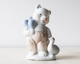 Blue and white vintage Teddy Bear and goose figurine
