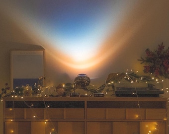 Lens swap mood table lamp with dynamic movement technology and circadian effect
