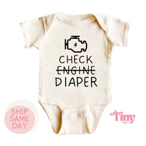 May include: A white baby onesie with a black check engine light icon and the text "CHECK ENGINE DIAPER" printed on it.