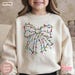 Christmas Lights Coquette Bow Kids Sweatshirt, Funny Xmas Shirt, Holiday Sweater for Children image 1