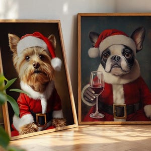 May include: Two framed art prints featuring dogs dressed in Santa Claus outfits. One print shows a Yorkshire Terrier, the other a French Bulldog holding a glass of red wine. Both dogs wear red suits and hats.