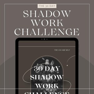 May include: A digital tablet shows the words "SHADOW WORK CHALLENGE" in white, with "THE 30 DAY" above and "THE AWARE SELF" below. The tablet screen displays a floral design and the words "30 DAY SHADOW WORK CHALLENGE". The background is a muted brown.