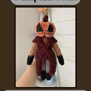 May include: A handmade crochet Pumpkin Man doll with an orange pumpkin head, black triangle eyes, and a stitched mouth. The doll wears a burgundy coat and has brown arms with black cuffs. The text "Pumpkin Man" and "Low-Sew Crochet Pattern" are displayed.