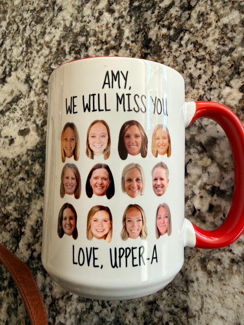 May include: A white ceramic mug with a red handle featuring a grid of twelve individual headshot photographs of people. The text at the top reads AMY, WE WILL MISS YOU and the text at the bottom reads LOVE, UPPER-A in black sans-serif font.