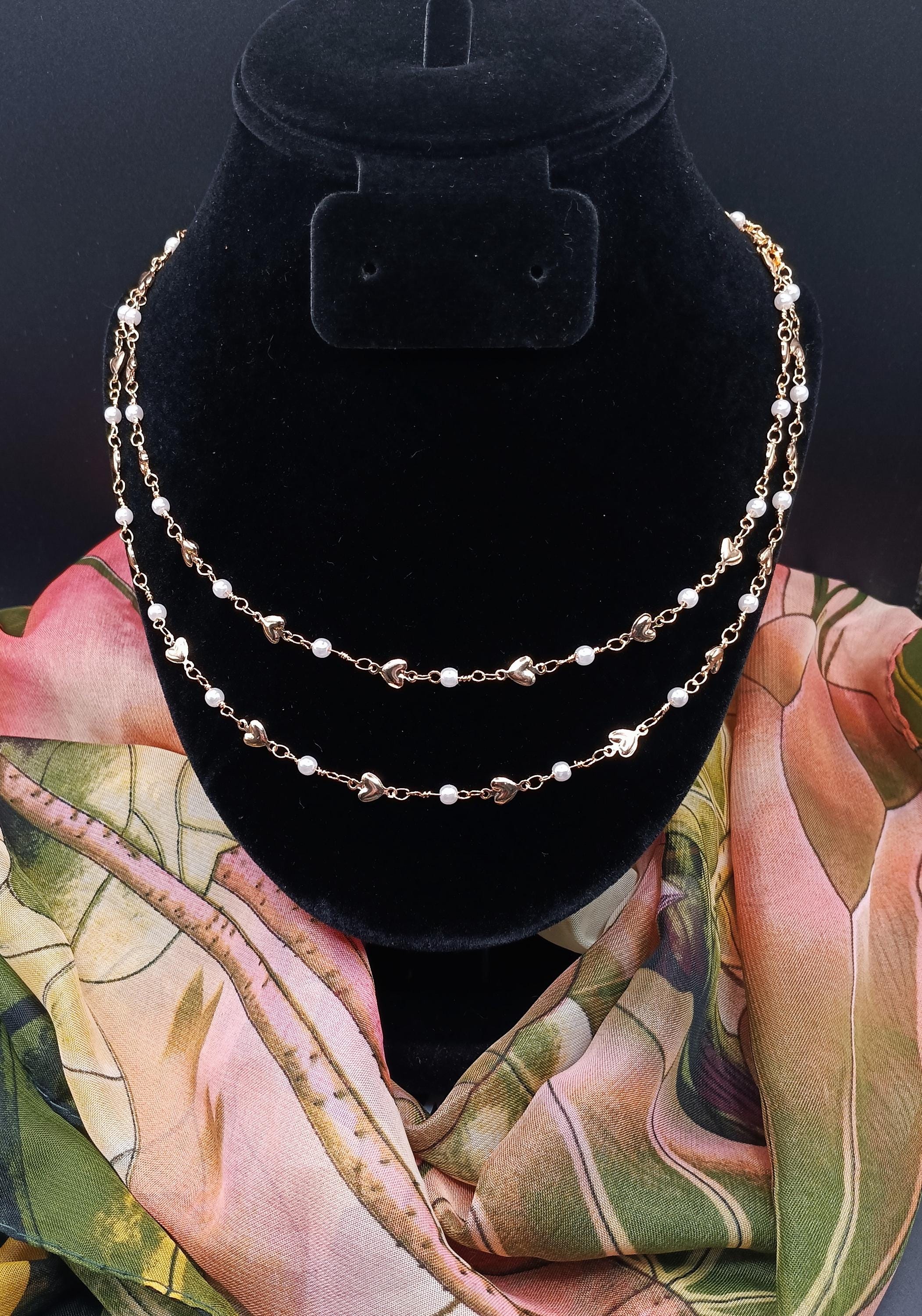 14k gold plated hearts & faux pearls create a delicate, adjustable necklace. Handcrafted. Hypoallergenic.