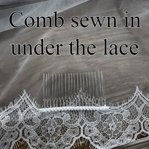 May include: Close-up of a white bridal veil with a delicate lace trim. The text "Comb sewn in under the lace" is visible. A clear comb is sewn into the veil for secure placement in the hair.