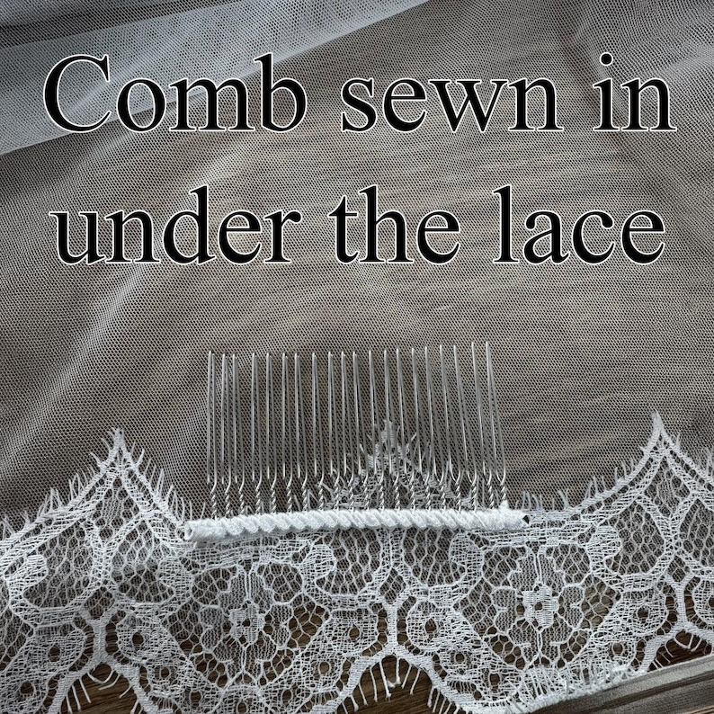 May include: Close-up of a white bridal veil with a delicate lace trim. The text "Comb sewn in under the lace" is visible. A clear comb is sewn into the veil for secure placement in the hair.