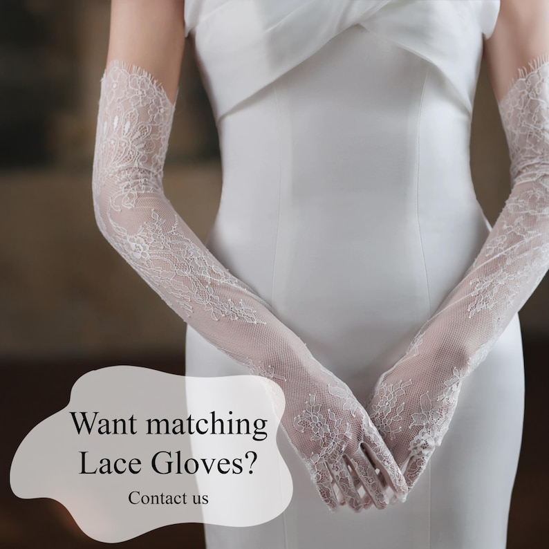 May include: White lace gloves with intricate floral patterns, extending to the upper arm. The gloves are paired with a white dress. Text on the image reads: "Want matching Lace Gloves? Contact us."