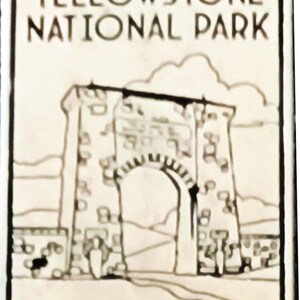 May include: A rectangular, off-white Yellowstone National Park souvenir with black text and a black and white illustration of a stone archway. The text reads "YELLOWSTONE NATIONAL PARK". A path leads to the archway.