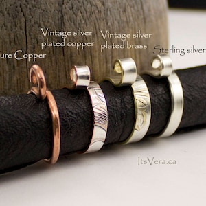 May include: A selection of rings made from different metals: pure copper, vintage silver-plated copper, vintage silver-plated brass, and sterling silver. The rings are presented on a black surface. Text on the image reads: Pure Copper, Vintage silver plated copper, Vintage silver plated brass, Sterling silver, and ItsVera.ca.