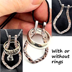 May include: Silver pendant necklace with a hammered texture, designed to hold rings. The pendant has a unique shape and is shown with and without rings. The text "With or without rings" is visible.