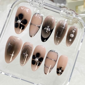 Silver chrome accented press on nails, short almond nude base. Hand-painted elegant dark aesthetic holiday birthday nails