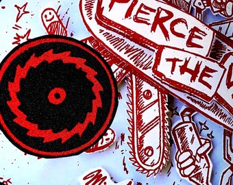 May include: A red and black circular saw blade patch with the text "Pierce the Veil" and "Misadventures" in red on a blue background.