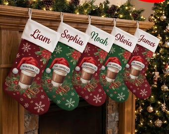 May include: Five Christmas stockings hanging in a row, each featuring a white cuff with a personalized name: Liam, Sophia, Noah, Olivia, and James. The stockings display a coffee cup wearing a Santa hat, pinecones, and snowflakes.