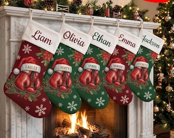 May include: Five Christmas stockings hanging on a fireplace mantel, each featuring a white cuff with a custom name, a red boxing glove graphic, and a festive pattern of poinsettias, pine branches, and white snowflakes on a red or green background.