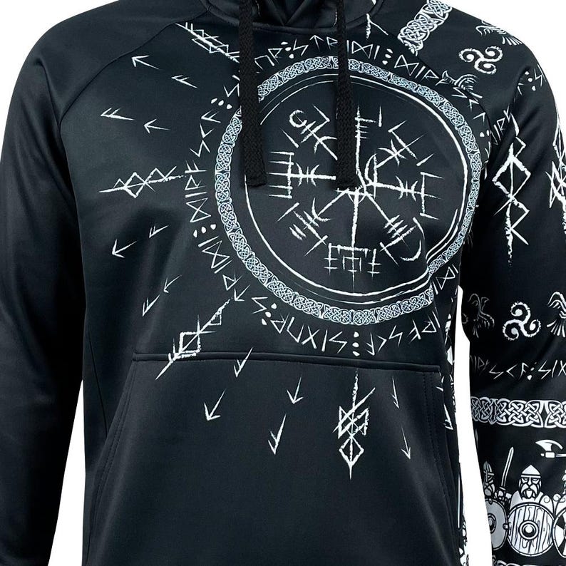 May include: Black hooded sweatshirt with a white print of a compass and other symbols. The print is a stylized design of Norse runes and other symbols.