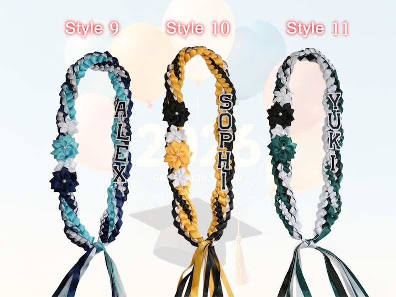 May include: Three graduation leis in the image. Each lei is braided with ribbons in various colors, including blue, white, black, yellow, and green. Each lei has a name spelled out in individual letters. Floral accents and ribbons complete the design.