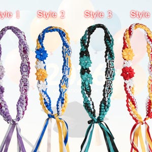 May include: Four graduation leis in various styles. Style 1 is purple and white with the name "ROSE". Style 2 is blue and yellow with the name "KIMMY". Style 3 is black and teal with the name "HENRY". Style 4 is red and yellow with the name "GRACE".