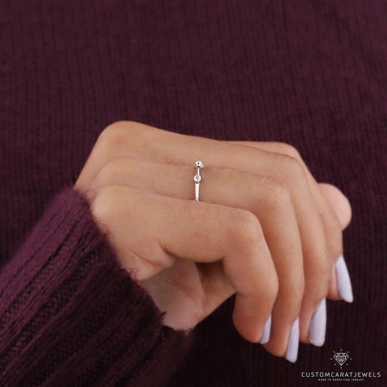 Velvet box display of diamond station band in white gold, ideal for gifting or wedding proposal.
ring in box, diamond band, station design, white gold ring, bridal accessory, anniversary gift, fine jewelry, wedding proposal, dainty sparkle, stacking ring, elegant design, minimalist ring, chic presentation, gold clarity, subtle shine