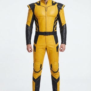 May include: A yellow and black full-body jumpsuit featuring a high collar, a front zipper closure, structured shoulder panels, and a black belt at the waist. The garment includes black accents along the arms, legs, and knees, paired with black boots.