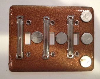 Triple toggle light switch plate