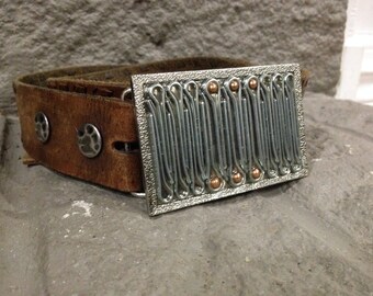 Unique metal assemblage belt buckle