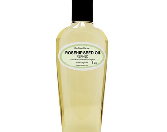 Può includere: Una bottiglia di vetro trasparente da 237 ml di olio di semi di rosa canina, raffinato, 100% puro spremuto a freddo biologico, di Dr Adorable Inc. La bottiglia ha un tappo nero e un'etichetta verde con testo bianco.