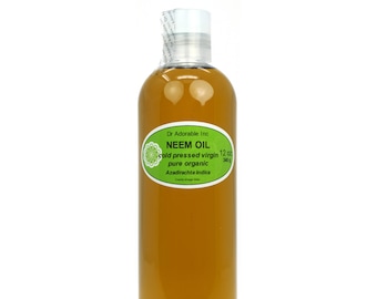 May include: A clear glass bottle filled with amber-colored Neem oil. The label is green and reads "Dr Adorable Inc. NEEM OIL cold pressed virgin pure organic Azadirachta indica 12 oz 340g".