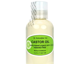 May include: A clear glass bottle with a green label that reads "Dr. Adorable Inc. CASTOR OIL cold pressed organic pure HEXANE FREE Ricinus communis Country of origin India" and a white label that reads "4 oz".