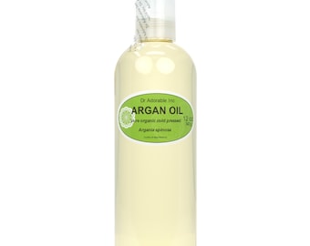 May include: A clear glass bottle of 12 oz (340 ml) of pure organic cold-pressed argan oil. The label is green and white with the text "Dr Adorable Inc. ARGAN OIL pure organic cold pressed 12 oz (340 ml) Argania spinosa".