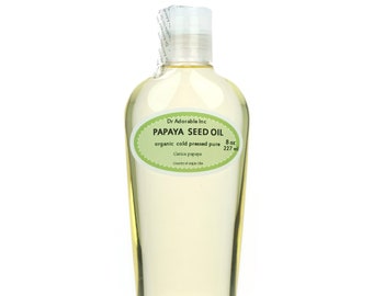 May include: A clear glass bottle of papaya seed oil, labeled "Dr Adorable Inc. PAPAYA SEED OIL organic cold pressed pure Carica papaya 8 oz 227 ml Country of origin USA"