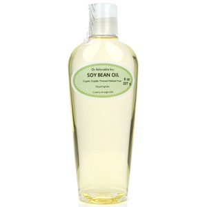 May include: A clear glass bottle of organic soy bean oil with a green label that reads "Dr Adorable Inc SOY BEAN OIL Organic Expeller Pressed Refined Pure Sojahispida Country of origin USA 8 oz 227 g"