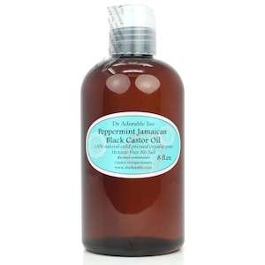 Może przedstawiać: Brązowa szklana butelka z białą etykietą, na której widnieje napis "Dr Adorable Inc Peppermint Jamaican Black Castor Oil 100% natural cold pressed organic pure Hexane Free No Salt Ricinus communis 8 fl.oz Country of origin Jamaica www.dradorable.com".