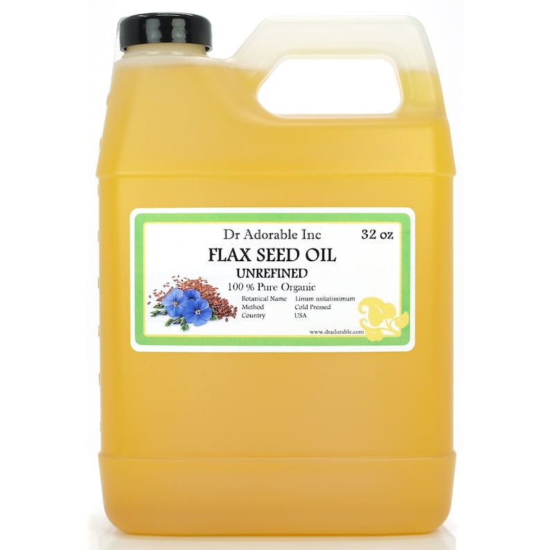 May include: A yellow plastic jug of flax seed oil with a black cap and a white handle. The label reads "FLAX SEED OIL UNREFINED 100% Pure Organic" and lists the botanical name, method, and country of origin. The jug contains 32 oz of oil.