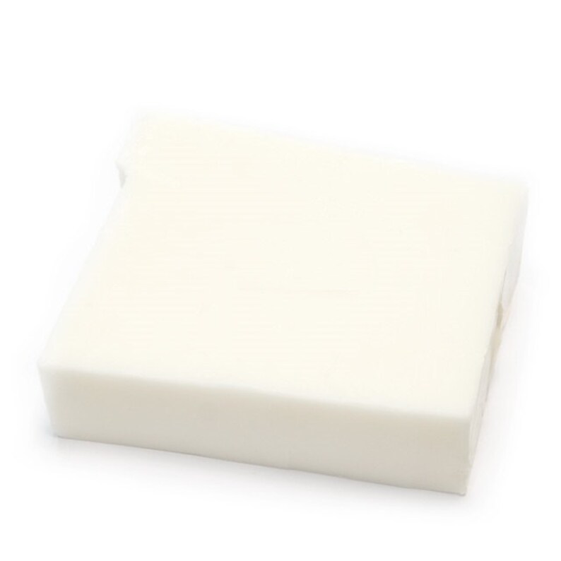 May include: A white rectangular block of soap.