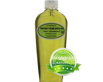 Pode incluir: Uma garrafa de vidro transparente de óleo de semente de figo da Índia com um rótulo verde que diz "Prickly Pear Seed Oil" e "organic cold pressed pure". A garrafa está etiquetada com a data de validade "12.2016". Um adesivo circular verde e branco com o texto "Guarantee 100% Natural" está na parte frontal da garrafa.