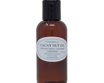 Könnte beinhalten: Eine braune Glasflasche mit Cacay-Nussöl, 100% rein, biologisch, kaltgepresst und unraffiniert, mit einem weißen Etikett, auf dem steht "Dr. Adorable inc CACAY NUT OIL 100% pure organic cold pressed UNREFINED 4.4 fl oz Caryodendron orinocense Country Brazil www.dradorable.com".