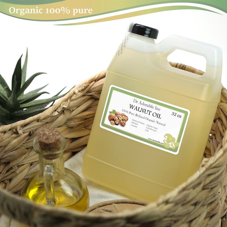 May include: A clear plastic jug of 32 oz organic walnut oil in a wicker basket. The label reads "Dr Adorable Inc. WALNUT OIL 100% Pure Refined Organic Natural".