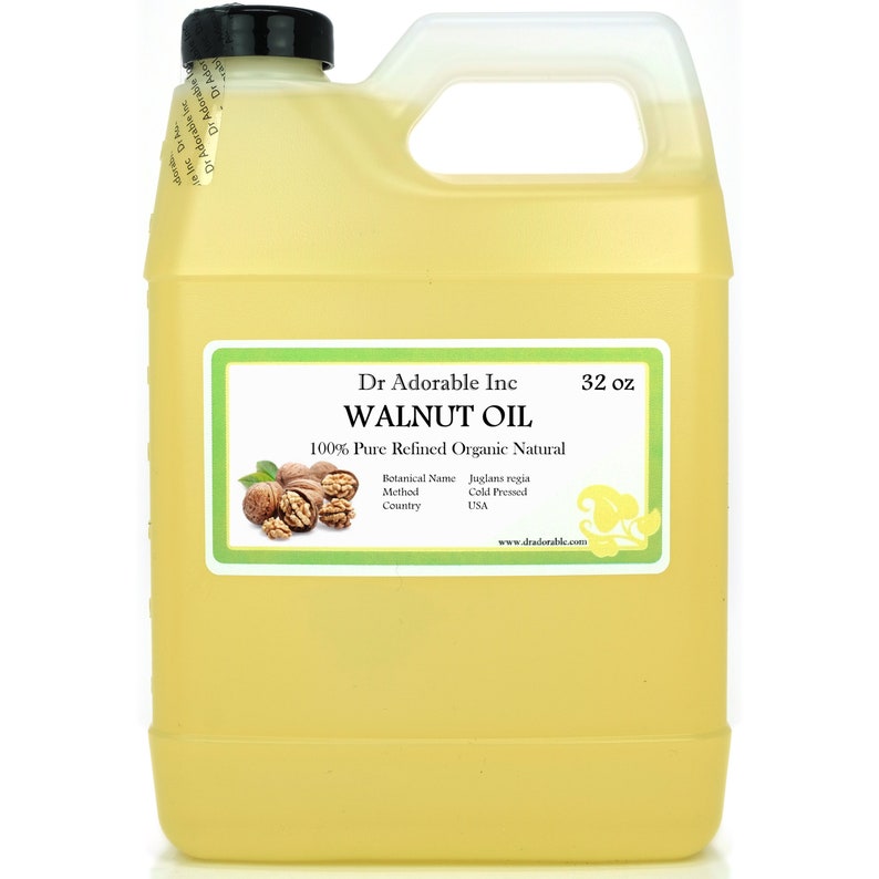 May include: A clear plastic jug with a yellow liquid inside. The label reads "Dr Adorable Inc WALNUT OIL 100% Pure Refined Organic Natural Botanical Name Juglans regia Method Cold Pressed Country USA www.dradorable.com 32 oz".