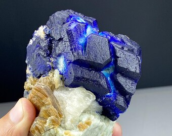 Lazurite with some fluorescent spots from Afghanistan.  564 grams  & 84x82x70mm