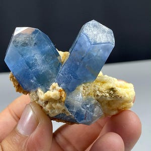 May include: A rustic wooden sign with the text "Welcome to our home" in white lettering. The sign features a distressed finish and a simple, inviting design, perfect for a front porch or entryway.