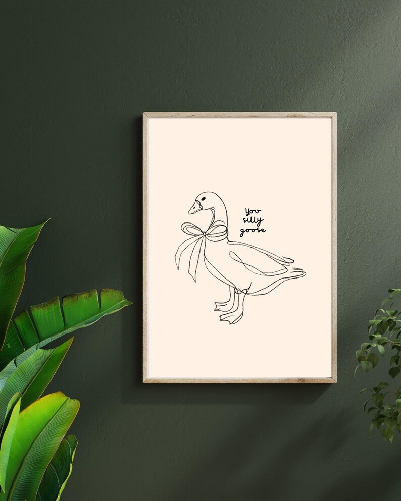 Minimalist line drawing of a goose wearing a bow, with playful handwritten text saying “you silly goose,” set on a soft cream background.