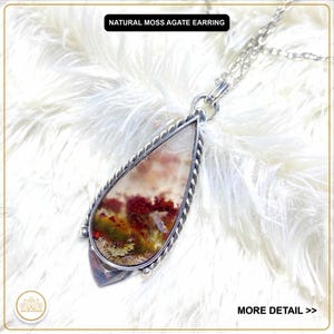 May include: A natural moss agate earring pendant with a silver chain. The pendant features a teardrop-shaped stone with red, green, and white inclusions, set in a silver frame with a twisted rope design. The text "NATURAL MOSS AGATE EARRING" is visible.