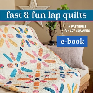 Puede incluir: Una colcha colorida con un patrón floral, hecha con cuadrados de 25,4 cm. La colcha está doblada en un sofá y el texto "fast & fun lap quilts" y "9 PATTERNS for 10" SQUARES e-book" es visible en la portada.
