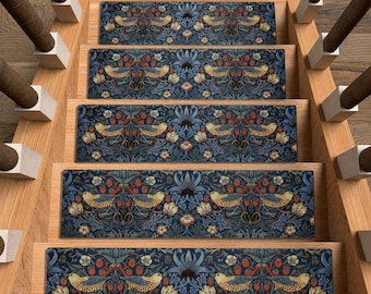May include: A set of five rectangular stair treads featuring a dark blue background with a repeating pattern of yellow birds, red berries, and light blue floral motifs. The treads are installed on wooden stairs with dark brown balusters.